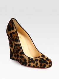 Luxe pony hair in an iconic leopard print, grounded by a substantial wedge. Self-covered wedge, 4 (100mm)Leopard-print pony hair upperLeather liningSignature red leather solePadded insoleMade in ItalyOUR FIT MODEL RECOMMENDS ordering one half size up as this style runs small. Luxe pony hair in an iconic leopard print, grounded by a substantial wedge. Self-covered wedge, 4 (100mm)Leopard-print pony hair upperLeather liningSignature red leather solePadded insoleMade in ItalyOUR FIT MODEL RECOMMENDS ordering one half size up as this style runs small.