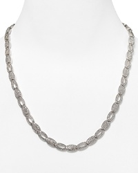 Shape meets sparkle on this silvery link necklace from Lora Paolo, featuring inset crystals and a delicate oval design. It's classic lines make it an elegant accessory for evening. Shape meets sparkle on this silvery link necklace from Lora Paolo, featuring inset crystals and a delicate oval design. It's classic lines make it an elegant accessory for evening.