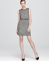 Details like gold-tone chain edging and a wispy faux patent leather belt bring hyper-modern sophistication to this Trina Turk dress that's just as chic in the office as it is off-hours. Details like gold-tone chain edging and a wispy faux patent leather belt bring hyper-modern sophistication to this Trina Turk dress that's just as chic in the office as it is off-hours.