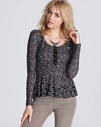 Warm up to pretty lace with this Free People top and its on-trend peplum waist. Warm up to pretty lace with this Free People top and its on-trend peplum waist.