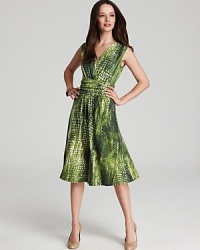 A vibrant exotic print enlivens a city-chic Jones New York Collection dress. Team with raffia accents and style your way through the concrete jungle. A vibrant exotic print enlivens a city-chic Jones New York Collection dress. Team with raffia accents and style your way through the concrete jungle.