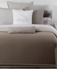 The signature Lacoste croc takes center stage on this simply sophisticated pure cotton decorative pillow. Featuring an embroidered gray crocodile on a white background. The signature Lacoste croc takes center stage on this simply sophisticated pure cotton decorative pillow. Featuring an embroidered gray crocodile on a white background.