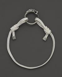 Eastern elements inform John Hardy's dragon head bracelet. It features a cotton cord band with an adjustable sliding closure. Eastern elements inform John Hardy's dragon head bracelet. It features a cotton cord band with an adjustable sliding closure.