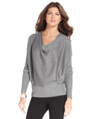 Shine on in Jones New York Signature's metallic knit sweater. In a slouchy silhouette, it adds the right relaxed touch to pants or skirts. Shine on in Jones New York Signature's metallic knit sweater. In a slouchy silhouette, it adds the right relaxed touch to pants or skirts.