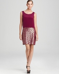 A sleek silhouette and metallic florals lend modern edge to a sleeveless DKNY dress. Slip a sharp blazer over the style and spark some serious fashion envy. A sleek silhouette and metallic florals lend modern edge to a sleeveless DKNY dress. Slip a sharp blazer over the style and spark some serious fashion envy.