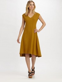 A casual dress that also scores major points in the style category, thanks to its unique wrap-inspired front.V-neckCap sleevesHi-lo hemEasy fitAbout 30 from natural waist55% hemp/45% organic cottonMachine washImported