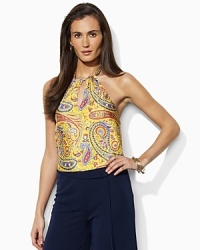 Luxuriously designed in breezy silk, the exquisite Aleschia halter top is finished with a vivid paisley print for a stunning look. Luxuriously designed in breezy silk, the exquisite Aleschia halter top is finished with a vivid paisley print for a stunning look.