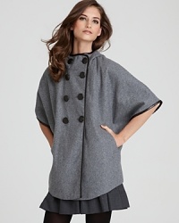 The covetable DKNY cape silhouette takes jacket form as your go-to layer for a fashion-forward winter. The covetable DKNY cape silhouette takes jacket form as your go-to layer for a fashion-forward winter.