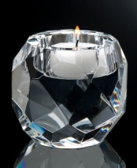 Light up a room with the brilliant Jackie votive by Oleg Cassini. Heavy crystal shaped by bold geometric cuts sets the mood with dazzling, designer style. Light up a room with the brilliant Jackie votive by Oleg Cassini. Heavy crystal shaped by bold geometric cuts sets the mood with dazzling, designer style.