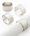 The natural world, refined. Shiny silver napkin rings with a texture reminiscent of wood grain spruce up modern tables for stylish entertaining.