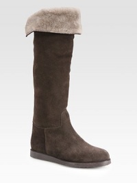 Infused with comfortable shearling lining, this suede knee-high design has grosgrain ribbon trim and a rubber sole. Rubber heel, 1 (25mm)Shaft, 18Leg circumference, 14Suede and grosgrain ribbon upperPull-on styleShearling liningRubber solePadded insoleMade in Italy Infused with comfortable shearling lining, this suede knee-high design has grosgrain ribbon trim and a rubber sole. Rubber heel, 1 (25mm)Shaft, 18Leg circumference, 14Suede and grosgrain ribbon upperPull-on styleShearling liningRubber solePadded insoleMade in Italy