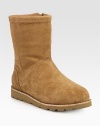 Buttery suede forms this go-to boot lined in shearling for superior comfort. Shaft, 8½Leg circumference, 14Suede upperSide zipShearling liningRubber trek solePadded insoleImported