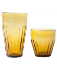 A fluted base, saturated color and bubbles suspended in the glass add a charming ease to Marcela's Rustic amber highball and double old-fashioned glasses for Prima Design. A fluted base, saturated color and bubbles suspended in the glass add a charming ease to Marcela's Rustic amber highball and double old-fashioned glasses for Prima Design.