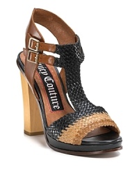A sophisticated sandal from Juicy, showcased in tri-tone woven leather and finished with a towering wooden heel. A sophisticated sandal from Juicy, showcased in tri-tone woven leather and finished with a towering wooden heel.