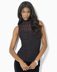 A stretch ribbon lace construction lend a chic and glamorous update to this stunning mockneck top. A stretch ribbon lace construction lend a chic and glamorous update to this stunning mockneck top.