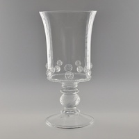 Mouth-blown by artisans in the hills outside Prague, this footed vase is delicate and refined. Featuring the brand's signature thread and berry detailing, it is ideal for flowers, shells or crystal pebbles. Mouth-blown by artisans in the hills outside Prague, this footed vase is delicate and refined. Featuring the brand's signature thread and berry detailing, it is ideal for flowers, shells or crystal pebbles.