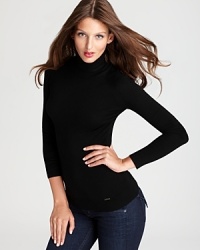 Upgrade your basics with this chic Rachel Roy turtleneck, rendered in luxe merino wool for a sumptuous silhouette that stuns with understated elegance. Upgrade your basics with this chic Rachel Roy turtleneck, rendered in luxe merino wool for a sumptuous silhouette that stuns with understated elegance.
