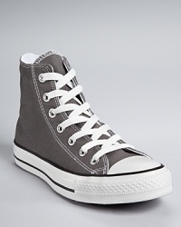 Versatile, classic Converse All Star sneakers deserve a spot in every closet, pairing perfectly with jeans or giving a suit some edge. Versatile, classic Converse All Star sneakers deserve a spot in every closet, pairing perfectly with jeans or giving a suit some edge.