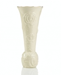 With lush roses and delicate dots carved in ivory porcelain, this classic vase offers a fine setting for small bouquets. A scalloped, gold-tipped rim adds an element of grandeur to your arrangement. With lush roses and delicate dots carved in ivory porcelain, this classic vase offers a fine setting for small bouquets. A scalloped, gold-tipped rim adds an element of grandeur to your arrangement.