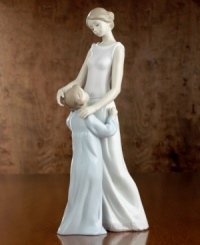 In Spain's renowned Lladró workshops, talented artisans create porcelain sculptures of the highest artistic and technical quality. This Lladró creation is made of fine porcelain, handpainted and glazed to express a special moment. Stands 14-1/2 tall. In Spain's renowned Lladró workshops, talented artisans create porcelain sculptures of the highest artistic and technical quality. This Lladró creation is made of fine porcelain, handpainted and glazed to express a special moment. Stands 14-1/2 tall.