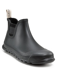 Elastic panels edge up these slick Tretorn rain boots, featuring pull tabs for easy on/off when the forecast spells showers. Elastic panels edge up these slick Tretorn rain boots, featuring pull tabs for easy on/off when the forecast spells showers.