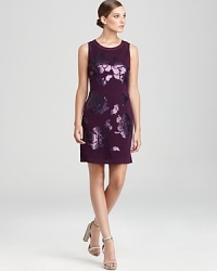 Shimmering sequins enliven oversized florals atop this DKNY dress, finished with a sheer overlay for a modern feminine statement. Style with strappy sandals and rock the fashion scene. Shimmering sequins enliven oversized florals atop this DKNY dress, finished with a sheer overlay for a modern feminine statement. Style with strappy sandals and rock the fashion scene.
