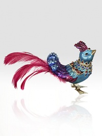 The fantasy of our animals are decorated and jeweled for the holidays. Adorn your tree with the sweet exotic bird in a brilliant blue with the shock of fuchsia tail feathers.GlassCrystalFeathersHandmade, hand-painted and hand-set6L X 3H X 1.5DImported The fantasy of our animals are decorated and jeweled for the holidays. Adorn your tree with the sweet exotic bird in a brilliant blue with the shock of fuchsia tail feathers.GlassCrystalFeathersHandmade, hand-painted and hand-set6L X 3H X 1.5DImported