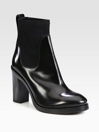 Instantly cool and on-trend, this shiny leather and stretchy neoprene ankle boot is a wardrobe must-have. Stacked heel, 4¼ (110mm)Stacked platform, ½ (15mm)Compares to a 3¾ heel (95mm)Shiny leather and neoprene upperPull-on styleLeather liningRubber solePadded insoleMade in Italy Instantly cool and on-trend, this shiny leather and stretchy neoprene ankle boot is a wardrobe must-have. Stacked heel, 4¼ (110mm)Stacked platform, ½ (15mm)Compares to a 3¾ heel (95mm)Shiny leather and neoprene upperPull-on styleLeather liningRubber solePadded insoleMade in Italy