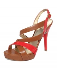 A shiny twist on a sophisticated style. Patent color blocking brightens up the classic silhouette of the strappy Dabrial2 platform sandals by GUESS. A shiny twist on a sophisticated style. Patent color blocking brightens up the classic silhouette of the strappy Dabrial2 platform sandals by GUESS.