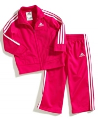 Actively start her sporty style with this athletic tricot jacket and pant set from adidas. Actively start her sporty style with this athletic tricot jacket and pant set from adidas.