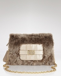 Lavish lamb fur makes a sophisticated soiree-ready statement on this DIANE von FURSTENBERG clutch, which hangs delicately from a glinting chain strap. Lavish lamb fur makes a sophisticated soiree-ready statement on this DIANE von FURSTENBERG clutch, which hangs delicately from a glinting chain strap.