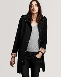 Effortless chic abounds in Burberry Brit's single-breasted rainwear jacket. A zip-out hood and wool lining add warmth and protection when the temperatures fall. Effortless chic abounds in Burberry Brit's single-breasted rainwear jacket. A zip-out hood and wool lining add warmth and protection when the temperatures fall.