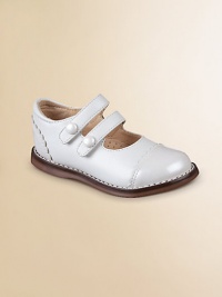 A classic silhouette with a scalloped-trim patent toe and heel and a double strap closure with decorative buttons for sweet style. Double grip-tape closure Leather upper with synthetic details Rubber sole Padded insole Leather lining ImportedPlease note: It is recommended that you order a ½ size smaller than measured. If your child measures a size 7.0, you may want to order a 6½. A classic silhouette with a scalloped-trim patent toe and heel and a double strap closure with decorative buttons for sweet style. Double grip-tape closure Leather upper with synthetic details Rubber sole Padded insole Leather lining ImportedPlease note: It is recommended that you order a ½ size smaller than measured. If your child measures a size 7.0, you may want to order a 6½.