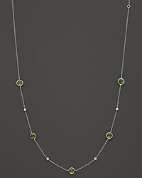 Bezel set diamonds and peridot stones in a sterling silver chaing from Ippolita. Bezel set diamonds and peridot stones in a sterling silver chaing from Ippolita.