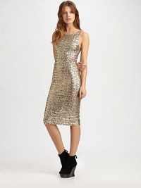 Ultra-fitted and dripping with sequins, this body-con style is cut in a slightly elongated sheath.High scoopneckSleevelessFlat frontCenter back zipperMesh panelBack slitAbout 26 from natural waist95% nylon/5% spandexDry cleanImportedModel shown is 5'8½ (174cm) wearing US size 4. Ultra-fitted and dripping with sequins, this body-con style is cut in a slightly elongated sheath.High scoopneckSleevelessFlat frontCenter back zipperMesh panelBack slitAbout 26 from natural waist95% nylon/5% spandexDry cleanImportedModel shown is 5'8½ (174cm) wearing US size 4.