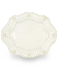 Serve every main course with exquisite taste. Featuring a raised pattern of cascading vines, elegant fluting and a gently scalloped rim, this large oval platter brings distinctly vintage style to the table. Coordinates with Butler's Pantry dinnerware and dishes collection. Serve every main course with exquisite taste. Featuring a raised pattern of cascading vines, elegant fluting and a gently scalloped rim, this large oval platter brings distinctly vintage style to the table. Coordinates with Butler's Pantry dinnerware and dishes collection.