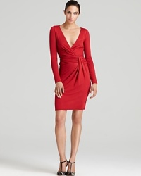 Impeccably crafted with a draped waist and plunging neckline this Halston Heritage dress skims your curves for bold feminine allure. Garnish with gold accents and ignite the night. Impeccably crafted with a draped waist and plunging neckline this Halston Heritage dress skims your curves for bold feminine allure. Garnish with gold accents and ignite the night.