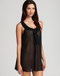 Flora Nikrooz's dramatic chiffon babydoll features a beaded Peter Pan collar with a bow detail and matching thong. Flora Nikrooz's dramatic chiffon babydoll features a beaded Peter Pan collar with a bow detail and matching thong.