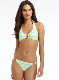 THE LOOKAllover tie dye printEmbellished O-ring detailPadded cupsBack tie closureTHE MATERIAL80% nylon/20% spandexFully linedCARE & ORIGINHand washMade in USAPlease note: Bikini bottom sold separately. THE LOOKAllover tie dye printEmbellished O-ring detailPadded cupsBack tie closureTHE MATERIAL80% nylon/20% spandexFully linedCARE & ORIGINHand washMade in USAPlease note: Bikini bottom sold separately.