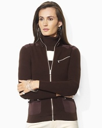 Rendered in a full-zip silhouette with chic microfiber details, the Lakelyn sweater is infused with athletic inspiration. Rendered in a full-zip silhouette with chic microfiber details, the Lakelyn sweater is infused with athletic inspiration.