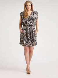 Short and sweet, this phenomenal design draws attention to your decolletage as it offers you a relaxed-yet-flattering fit.V-necklineCap sleevesAllover printFront pocketsAbout 19 from natural waistNylonDry cleanMade in USA Short and sweet, this phenomenal design draws attention to your decolletage as it offers you a relaxed-yet-flattering fit.V-necklineCap sleevesAllover printFront pocketsAbout 19 from natural waistNylonDry cleanMade in USA