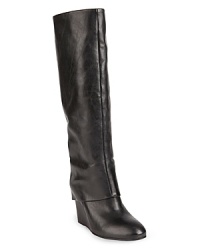 These STEVEN BY STEVE MADDEN wedge boots are at the height of fashion, with long, pants-friendly foldover cuffs that create a sleek look. These STEVEN BY STEVE MADDEN wedge boots are at the height of fashion, with long, pants-friendly foldover cuffs that create a sleek look.