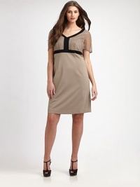 An elegant design with simple-chic appeal, courtesy of a flattering v-neckline and Empire waist as well as a pretty lace top. V-neckSheer short sleevesEmpire waistPrincess seamsContrast trimSide zipperFully linedAbout 24 from natural waist65% viscose/30% nylon/5% spandexDry cleanMade in Italy An elegant design with simple-chic appeal, courtesy of a flattering v-neckline and Empire waist as well as a pretty lace top. V-neckSheer short sleevesEmpire waistPrincess seamsContrast trimSide zipperFully linedAbout 24 from natural waist65% viscose/30% nylon/5% spandexDry cleanMade in Italy