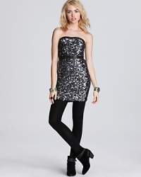 Downtown edge takes over in a luminous Free People dress. Shining sequins are emboldened with an edgy faux leather waist, in a look fit for a punk rock party queen.