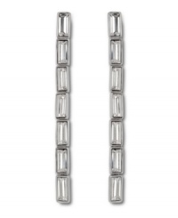 Elegant Art Deco inspiration defines these divine linear baguette crystal earrings from Swarovski. Set in silver tone mixed metal, they're an ideal look for a stylish soiree! Approximate length: 2-4/10 inches.