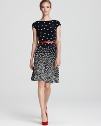 A swing skirt lends a ladylike look to this belted Anne Klein dress, printed with piling-up polka dots. A swing skirt lends a ladylike look to this belted Anne Klein dress, printed with piling-up polka dots.