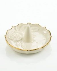 A single rose blossom and delicate dots carved in ivory porcelain make this classic ring holder a fine storage space for special jewelry. With a scalloped, gold-tipped rim. A single rose blossom and delicate dots carved in ivory porcelain make this classic ring holder a fine storage space for special jewelry. With a scalloped, gold-tipped rim.