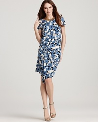 Bursting with blooms, this DKNY dress pairs pretty pastels with a flattering ruched silhouette for the ultimate in ladylike chic. Bursting with blooms, this DKNY dress pairs pretty pastels with a flattering ruched silhouette for the ultimate in ladylike chic.