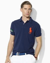 Accented with an iconic Big Pony at the chest, Ralph Lauren's official limited edition US Open polo shirt is tailored for a trim fit in breathable cotton mesh. Accented with an iconic Big Pony at the chest, Ralph Lauren's official limited edition US Open polo shirt is tailored for a trim fit in breathable cotton mesh.