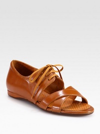 Crisscrossed straps add urban-cool style to this lace-up silhouette in buttery leather. Leather upperLeather lining and solePadded insoleMade in Spain Crisscrossed straps add urban-cool style to this lace-up silhouette in buttery leather. Leather upperLeather lining and solePadded insoleMade in Spain